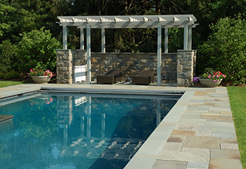 Modern swimming pool with pergola installation in San Fernando backyard.