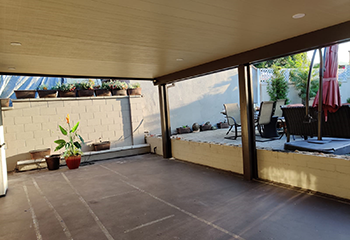 Covered patio with durable wooden beams and recessed lighting in Sun Valley.